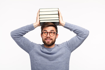 Smart man with stack of books