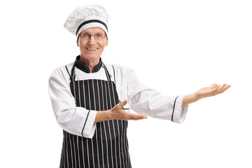 Wall Mural - Elderly chef gesturing with his hands