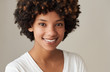 © mavoimages - Smiling young African woman with an afro and natural complexion