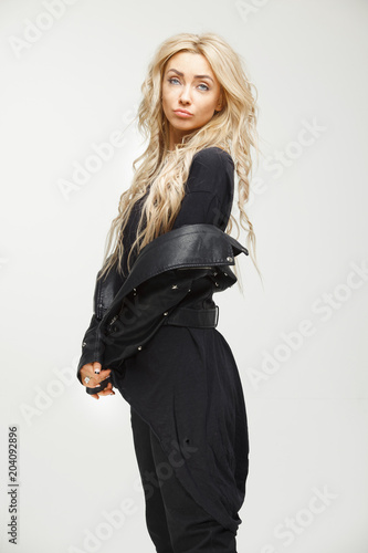 Valokuva portrait of capricious woman in black stylish swag style clothes on white background
