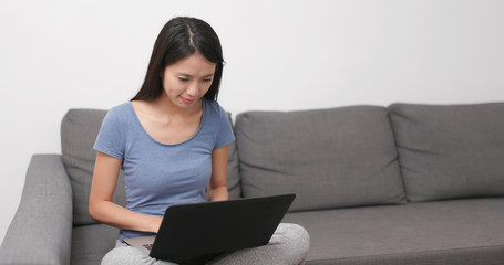 Wall Mural - Woman use of notebook computer at home