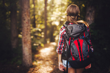 Wall Mural - beautiful woman hiking in forest