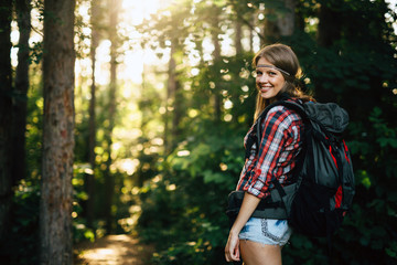 Wall Mural - beautiful woman hiking in forest