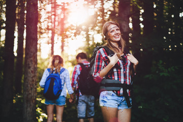 Wall Mural - people trekking in forest