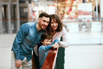 Wall Mural - Happy Family Shopping And Having Fun In Mall