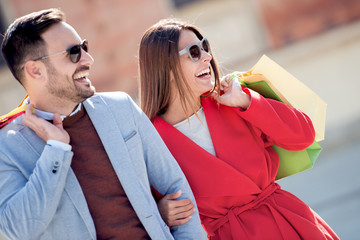 Canvas Print - Couple with bags in shopping