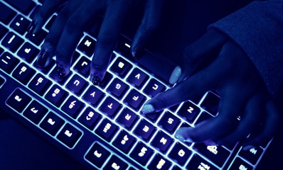 Wall Mural - closeup of hands using a keyboard