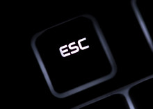 Closeup of a black computer keyboard and ESC button