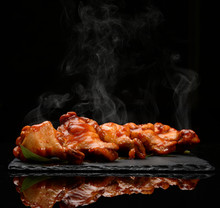 Hot And Spicy Bbq Chicken Wings With Dip And Hot Sauce On Black Stone Plate 