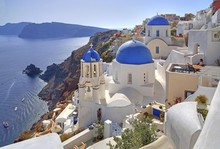 Townscape With Churches On The Hillside Overlooking Caldera, Oia, Santorini, Thira, Cyclades, Aegean Islands, Aegean Sea, Greece, Europe