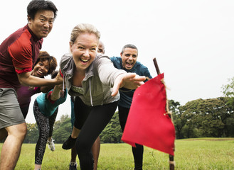 People racing to catch a flag