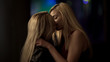 © motortion - Homosexual female couple making out in nightclub, passionate kiss of lesbians