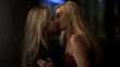 © motortion - Attractive blond ladies kissing tenderly in club, homosexual relations, passion