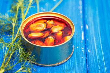 Wall Mural - mussels in small iron box on wooden background