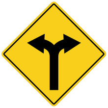 Yellow Sign With Two Arrows. Fork Road Yellow Warning Symbol. Two Directions On Yellow Road Sign.