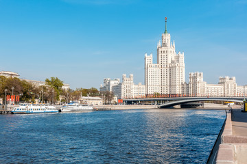 Wall Mural - Beautiful city summer landscape, the capital of Russia Moscow, the embankment of the river in the city center, view of the skyscraper on Kotelnicheskaya