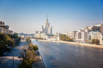 Wall Mural - Beautiful city summer landscape, the capital of Russia Moscow, the embankment of the river in the city center, view of the skyscraper on Kotelnicheskaya