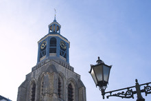 Clock In The Old Town Of Bergen Op Zoom, The Netherlands. Blue Sky. Tourism
