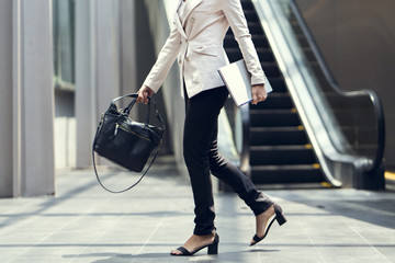 Wall Mural - Business woman walking to the office.