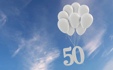 Number 50 Party Celebration. Number Attached To A Bunch Of White Balloons Against Blue Sky