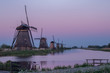 Windmills at kinderdijk in the blue hour with pink and purple sky