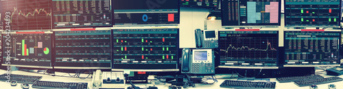 Fotografía Display of Stock market quotes and chart in monitor computer room with business office equipments