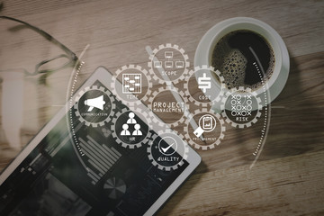 Poster - Coffee cup and Digital table dock smart keyboard,eyeglasses,stylus pen on wooden table,filter effect