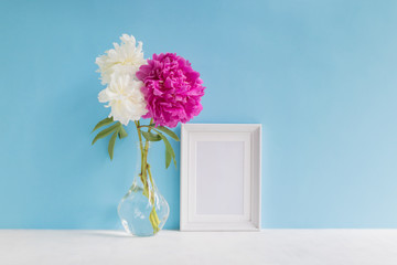 Wall Mural - Mockup with a white frame and white and pink peonies