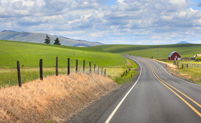 Scenic drive through farm landscape