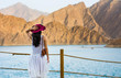 © creativefamily - Woman enjoying Hatta Dam Lake scenery in eastern Dubai, UAE
