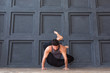 © uv_group - Young man practicing yoga asana and meditation on urban grunge background.