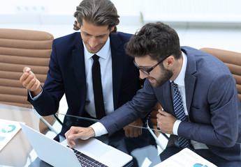 two business man working on laptop