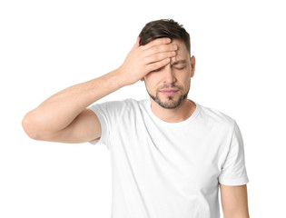 Wall Mural - Man suffering from headache on white background