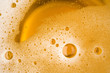 Close up Bubble froth of beer in glass or mug for background on top view