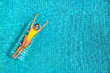 amazing beautiful girl in a yellow bikini air mattress swims in the pool of a luxury hotel, summer vacation, happiness, travel, smile joy, listening to music, drinking cocktail, top view