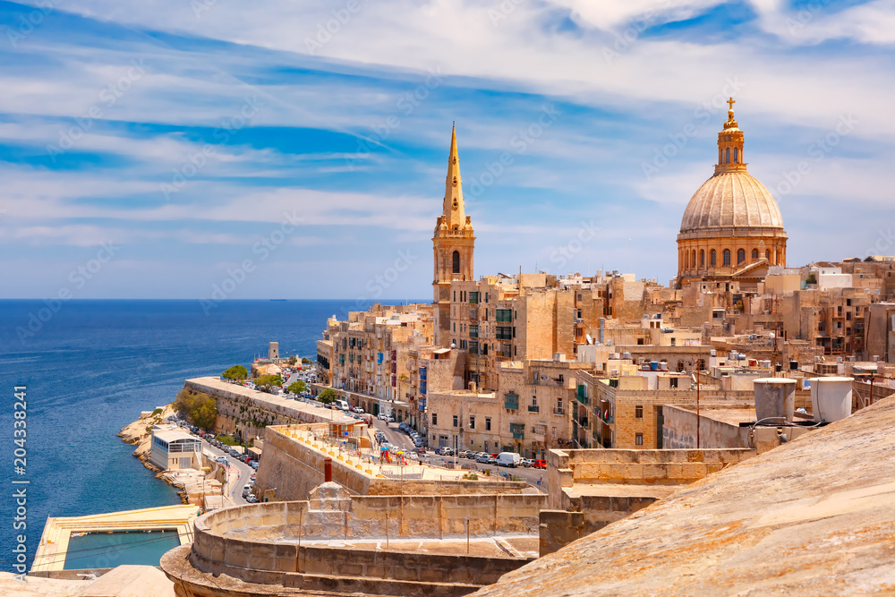 View from above of roofs and church of Our Lady of Mount Carmel and St. Paul's Anglican Pro-Cathedral, Valletta, Capital city of Malta - obrazy, fototapety, plakaty 