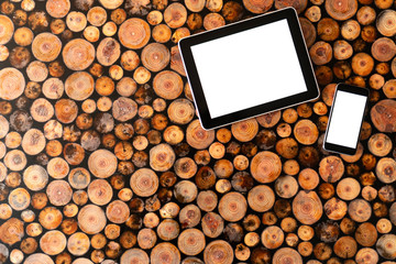 Wall Mural - Digital tablet pc and mobile phone on wood background.Felled wood. Wood texture