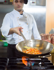 Wall Mural - Chef doing flambe on food