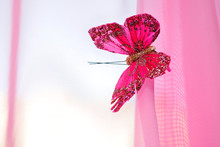 Pink Decorative Butterfly On Pink Fabric.
