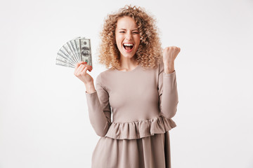 Sticker - Portrait of a cheerful young curly blonde girl in dress