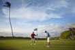 © Erickson Stock - Couple playing golf together.