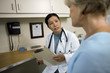 © Erickson Stock - Female doctor consulting with a patient after a medical examination in her office.