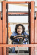 © Mint Images - Female employee using forklift