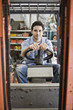 © Mint Images - Male employee using forklift