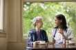 © Erickson Stock - Female nurse explaining how to take medication to a senior patient.