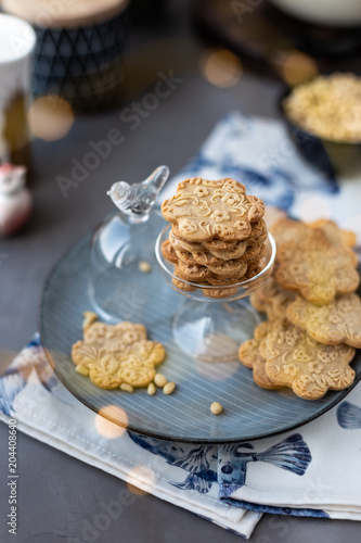 On The Plate Is A Curly Cookie With Decorative Patterns Made With