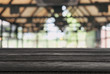 © Freedomz - Empty wooden table and blurred background of abstract in front of restaurant or coffee shop for display of product or for montage