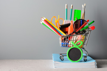 Wall Mural - Shopping cart with stationery on notebooks