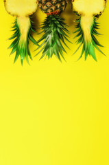 Wall Mural - pattern with bright pineapples on yellow background. top view. copy space. minimal style. pop art de