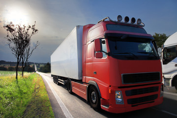 Truck transportation on the road at sunset